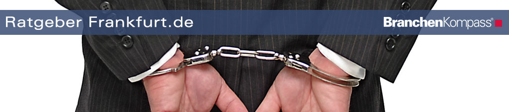 Mann im Anzug mit Handschellen – Symbolbild für Strafrecht Frankfurt